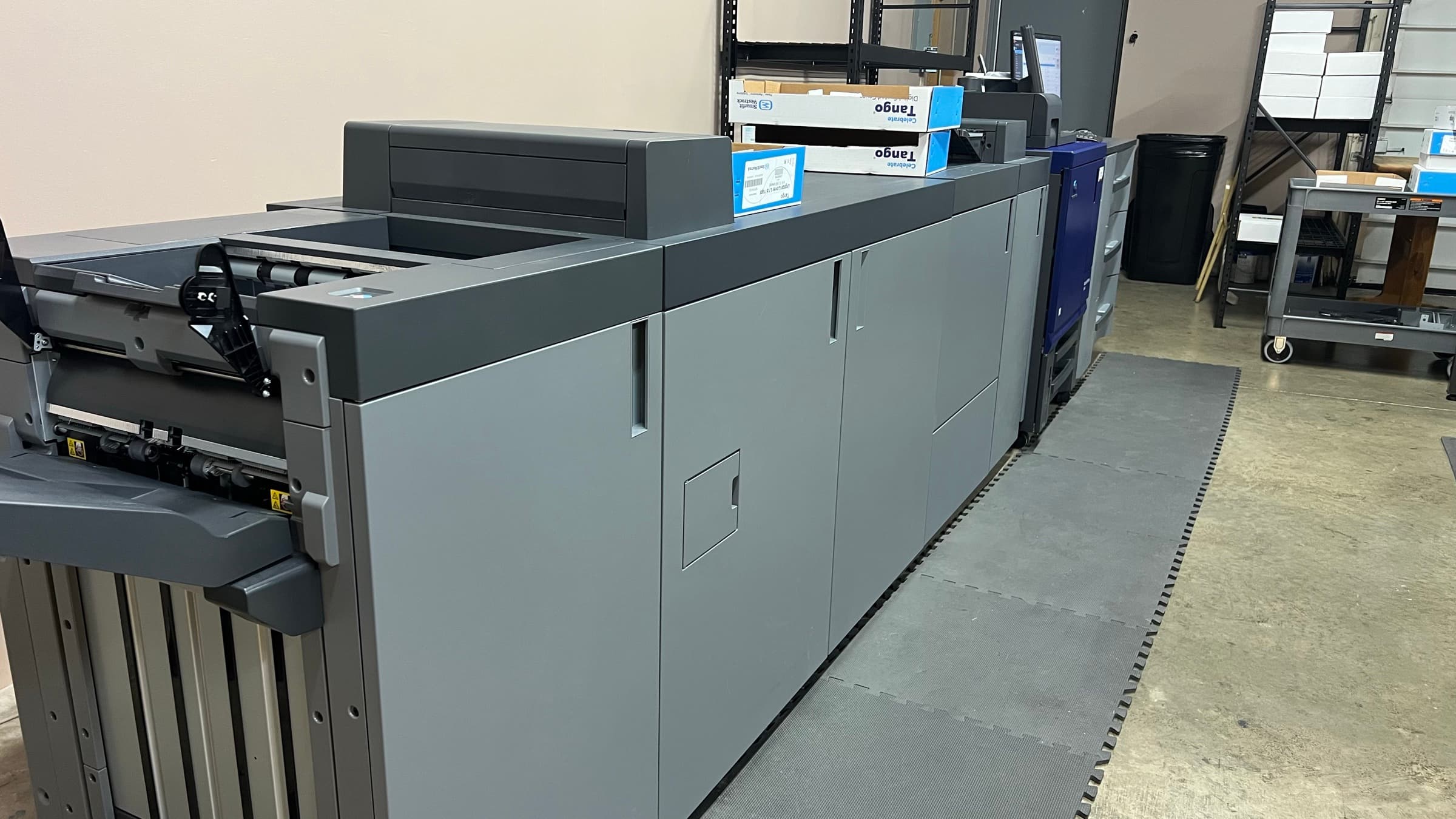 The digital press line in the Brand Mule shop, seen from the delivery end