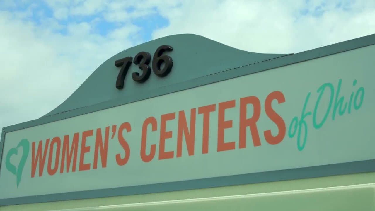 The Lebanon storefront, a teal facade with 736 above the Women’s Centers of Ohio name, against the sky